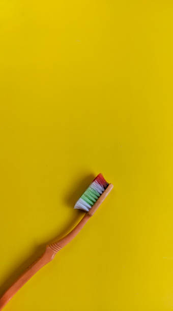 istock Brush your teeth on a yellow background 1408328958
