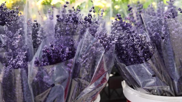 Basket with lavender flowers in market closeup