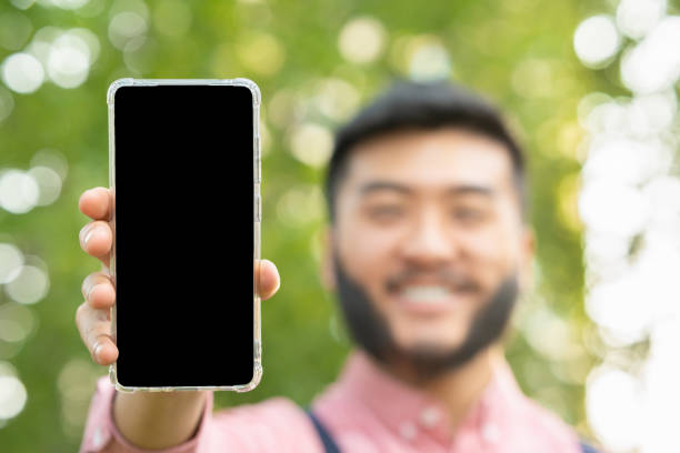 istock Screen of a mobile phone held by an man 1408331451