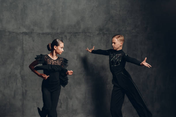 istock Young couple dancing in ballroom dance cha-cha-cha. 1408333667