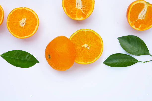 istock Orange fruit with green leaves on white background. 1408335513