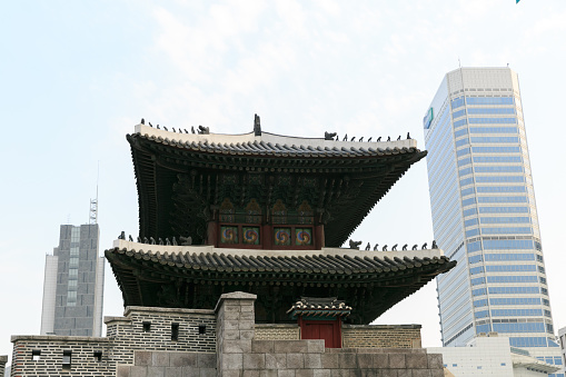Seoul, Korea - September 24, 2016: Tourists at Sungnyemun Gate - old and modern architecture in Seoul