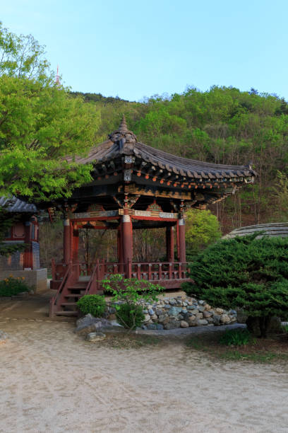 istock Buddhist temple in forest in Korea 1408336462