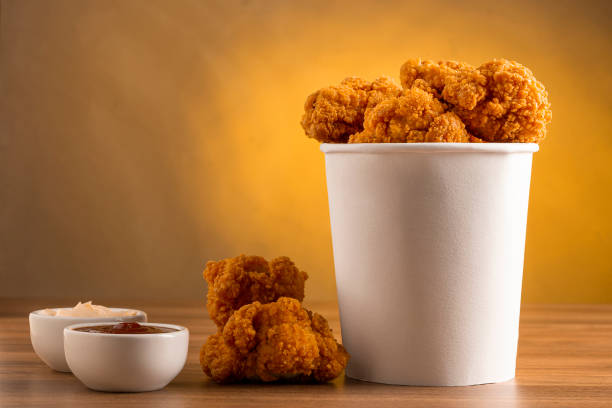 istock Crispy fried chicken in the bucket. Chicken bucket. 1408337796