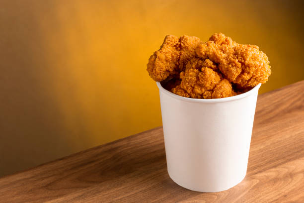 istock Crispy fried chicken in the bucket. Chicken bucket. 1408337811