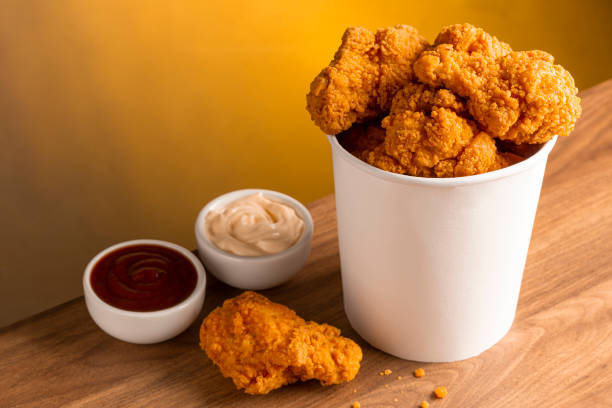 istock Crispy fried chicken in the bucket. Chicken bucket. 1408338333