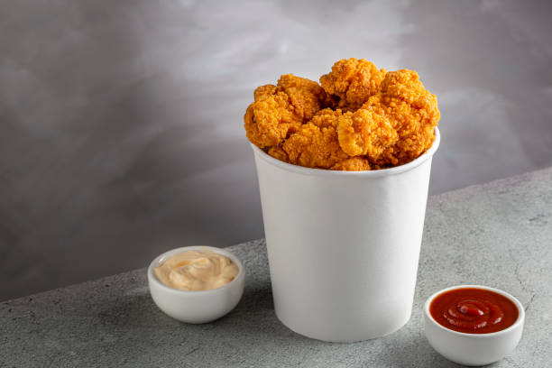 istock Crispy fried chicken in the bucket. Chicken bucket. 1408338339