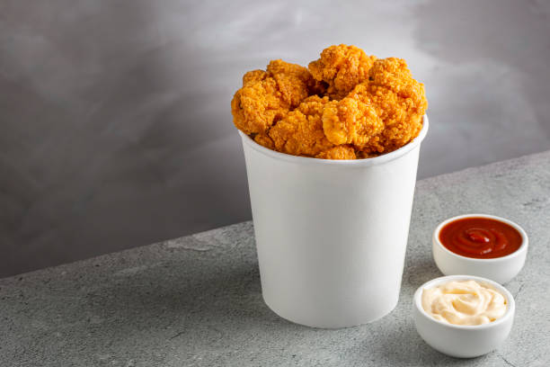 istock Crispy fried chicken in the bucket. Chicken bucket. 1408338342