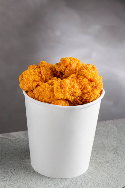 istock Crispy fried chicken in the bucket. Chicken bucket. 1408338348