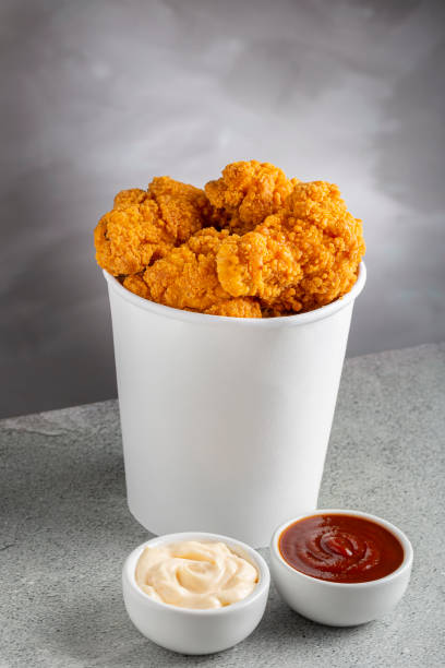 istock Crispy fried chicken in the bucket. Chicken bucket. 1408338358