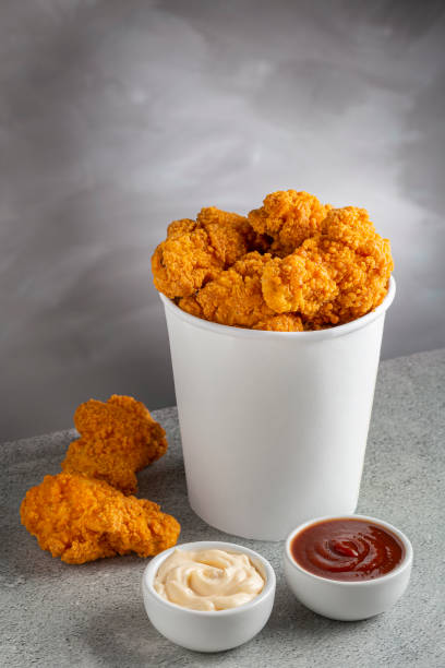 istock Crispy fried chicken in the bucket. Chicken bucket. 1408338375