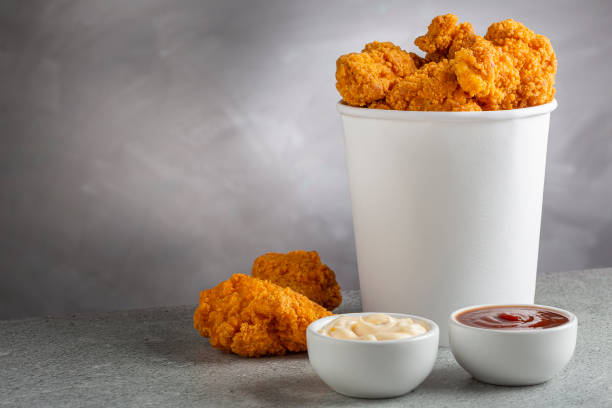 istock Crispy fried chicken in the bucket. Chicken bucket. 1408338381