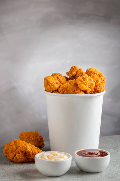 istock Crispy fried chicken in the bucket. Chicken bucket. 1408338387