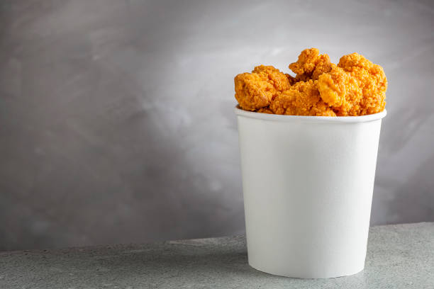 istock Crispy fried chicken in the bucket. Chicken bucket. 1408338389