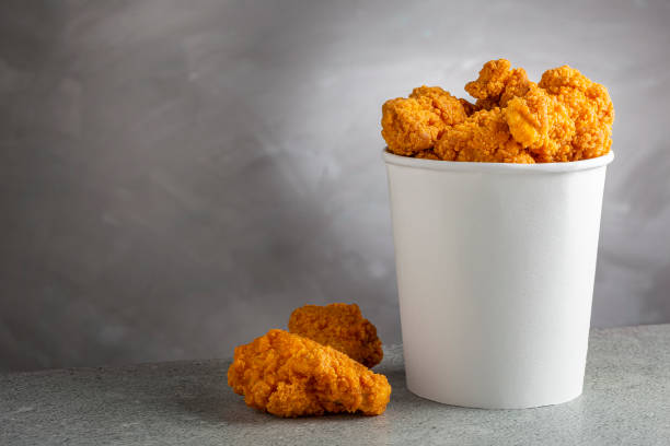 istock Crispy fried chicken in the bucket. Chicken bucket. 1408338390