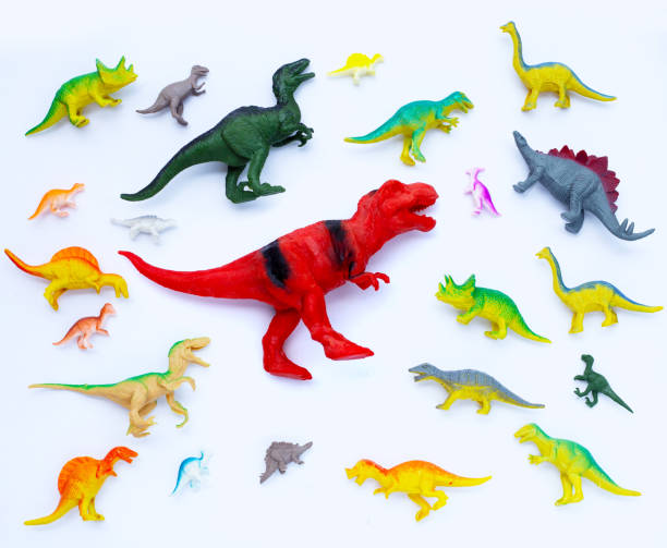 istock Plastic dinosaur toys on white background. Top view 1408340617