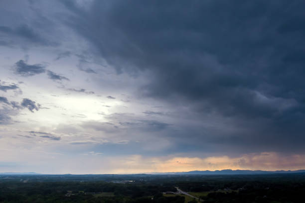 istock During sunset, a dramatic panorama shows storm clouds in the sky 1408340695