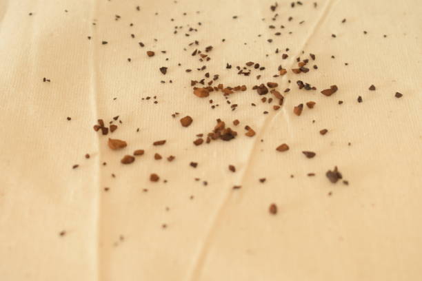 an brown instants coffee on white warm sheet cloth