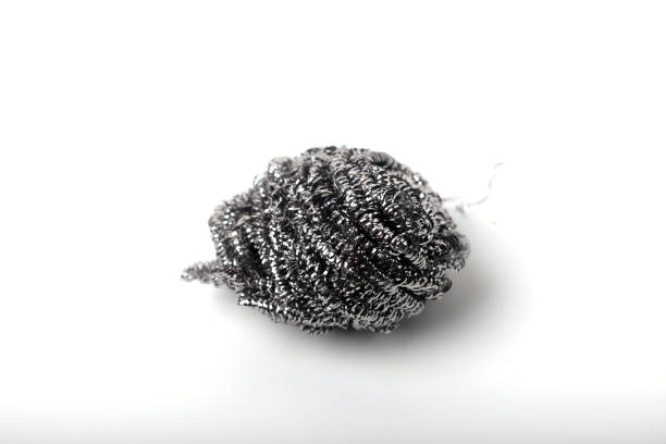 istock Metal sponge for cleaning and washing dishes on white background with copyspace 1408344232