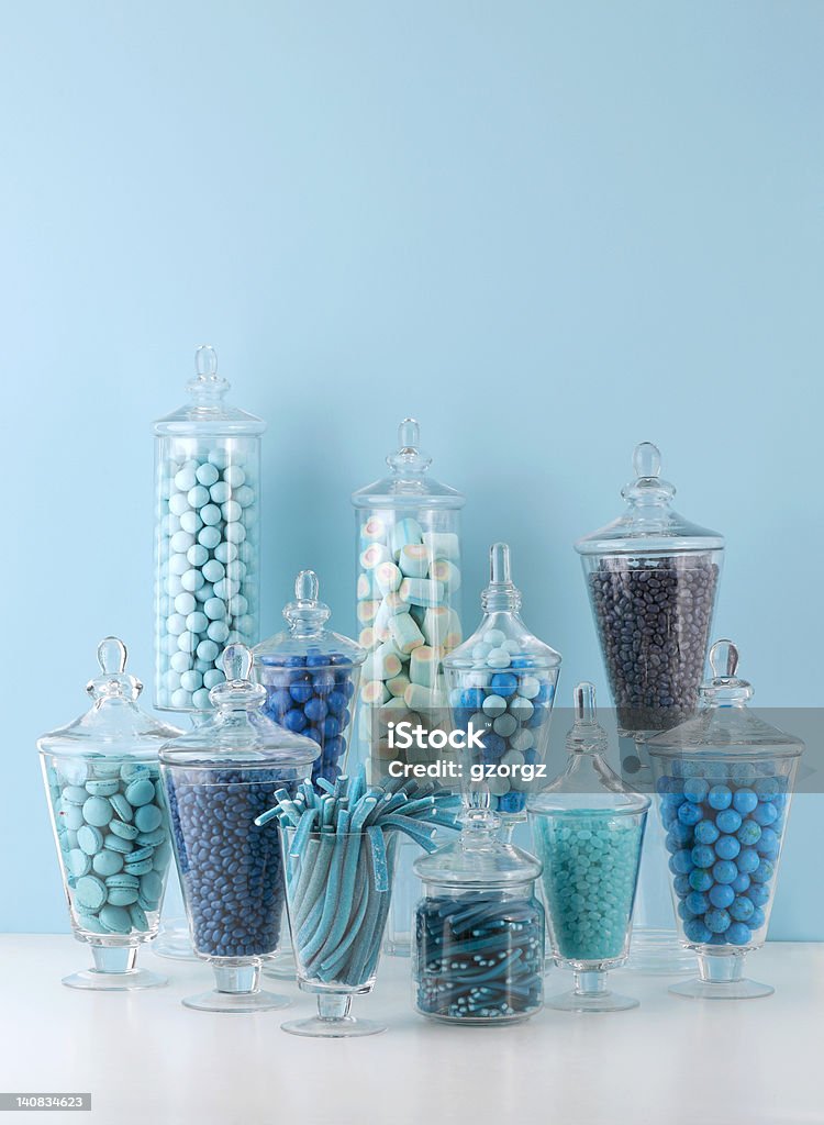 Candy bowls Candy In Bowls On Blue Background Arrangement Stock Photo