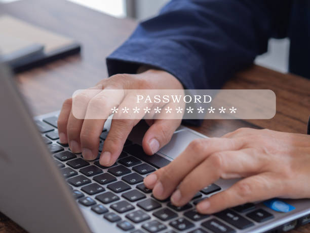 istock User typing password on a laptop to access personal user data on the workplace, 1408347138