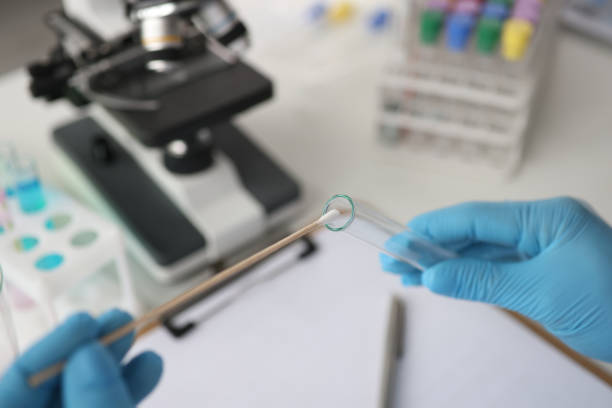 Doctor of laboratory diagnostics making DNA examination to determine paternity closeup Doctor of laboratory diagnostics making DNA examination to determine paternity closeup. PCR diagnostics of sexually transmitted infections concept paternity stock pictures, royalty-free photos & images