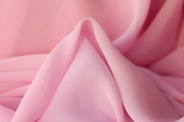 istock Cotton synthetic fabric in soft pink color closeup 1408348518