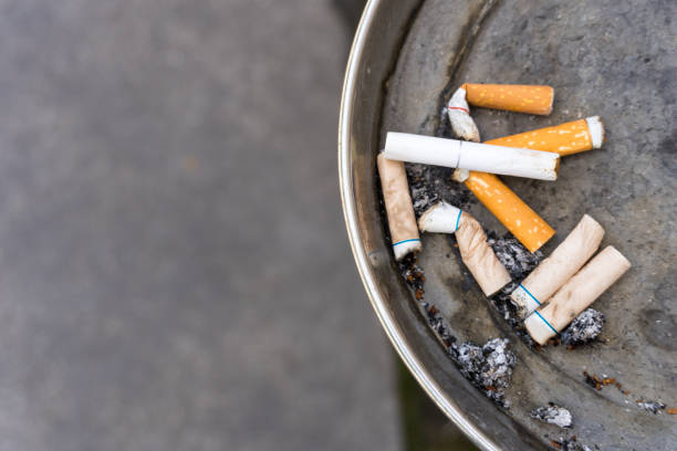 istock Closeup ashtray cigarettes copy space concept smoking 1408348659
