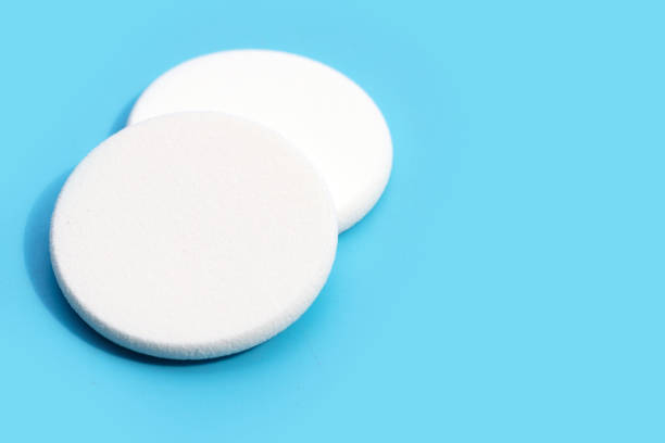 istock Sponge for face make-up cleaning on blue background 1408352658