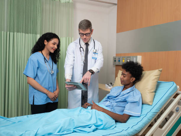 istock Doctor visit patient in treatment room 1408353905