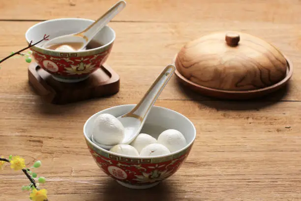 Glue Pudding or Tangyuan in Bowl.Chinese Lantern Festival Food. On Wooden Table