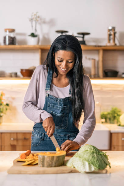 istock Happy Woman Cooking at Home 1408354881
