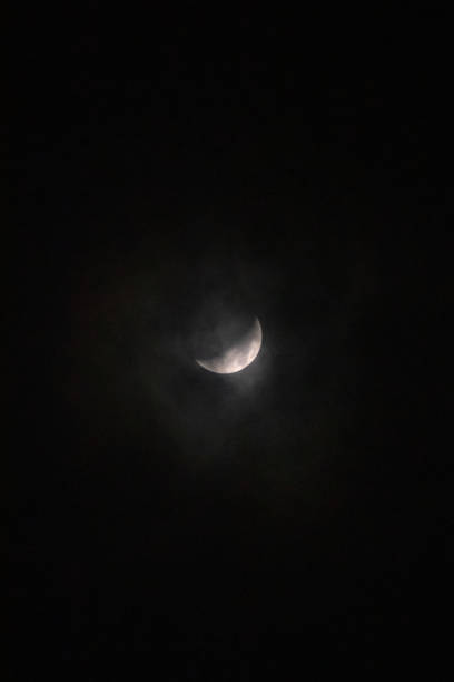 istock the crescent moon shining behind the cloud 1408358016