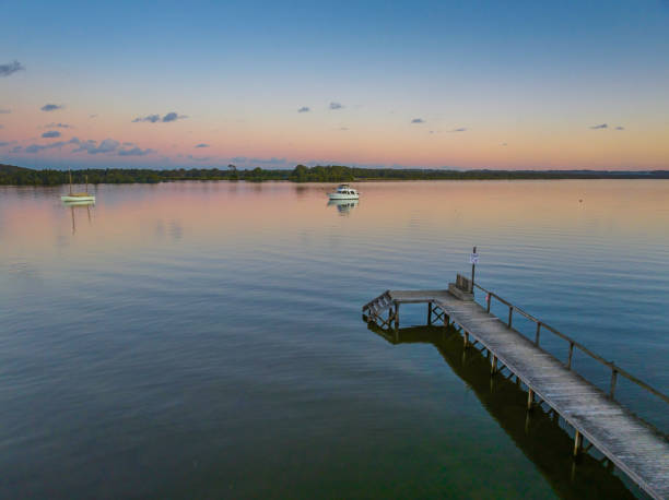 istock Sunset over the river with boats 1408363036