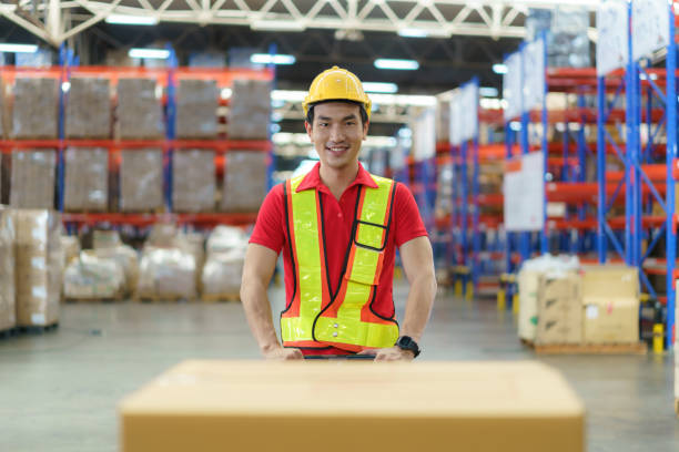 istock Asian man Warehouse worker unloading pallet shipment goods into a truck container, warehouse industry freight, logistics and transport. 1408363832