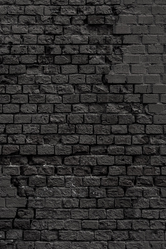 Brick wall of the building. Designer building background.