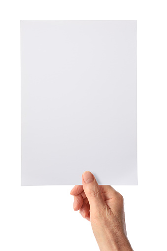 Close-up of a hand holding a blank document on white background.