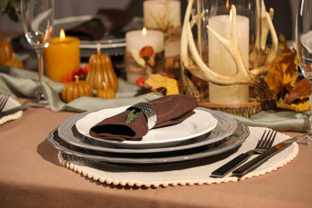 istock Beautiful autumn place setting and decor for festive dinner on table 1408372534