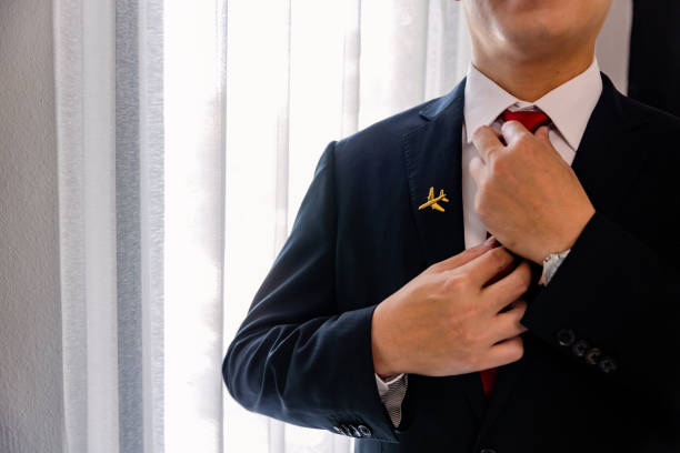 istock Cabin Crew getting dress for work, portrait. 1408373411