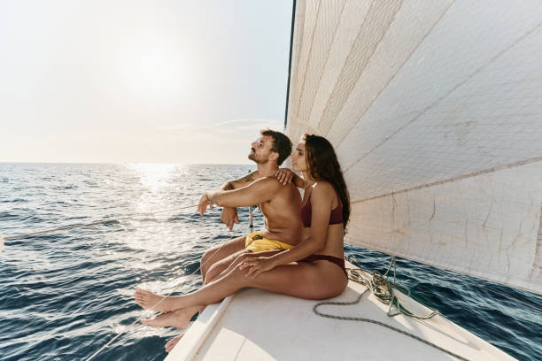 istock Young relaxed couple spending a summer day on a yacht. 1408374394