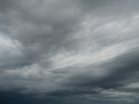 Cumulonimbus cloud formations on tropical blue sky , Nimbus moving , Abstract background from natural phenomenon and gray clouds hunk , Thailand