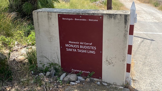 Parc del Garraf, Spain – June 19, 2022: Sign of Monjos Budistes Sakya Tashi Ling (EN: Sakya Tashi Ling Buddhist Monks) at the Contemporary Buddhist monastery of Garraf Natural Park.