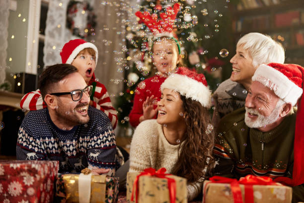 istock Cheerful extended family talking while celebrating New Year at home. 1408375799