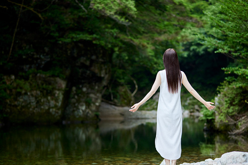 Japanese woman who breathes deep in nature