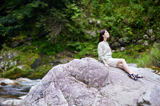 Japanese woman relaxing in nature