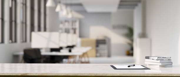 istock Office tabletop workspace with clipboard paper and copy space over blurred office background 1408377180