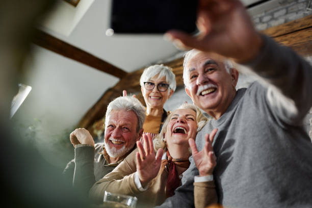 istock Cheerful seniors taking a selfie at home. 1408377242