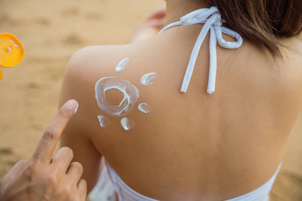 istock young man applying suntan lotion with sun shape on girlfriend back shoulder 1408377505
