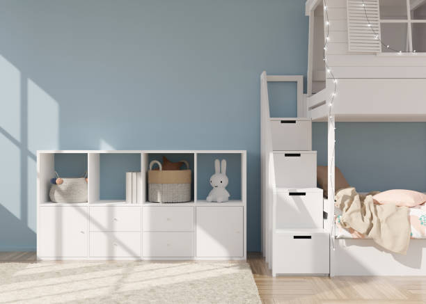 istock Empty light blue wall in modern child room. Mock up interior in scandinavian style. Copy space for your picture or poster. Bed, sideboard, toys. Cozy room for kids. 3D rendering. 1408377827