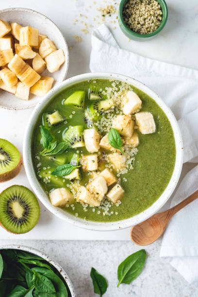 istock Vegan green smoothie bowl with toppings 1408378666